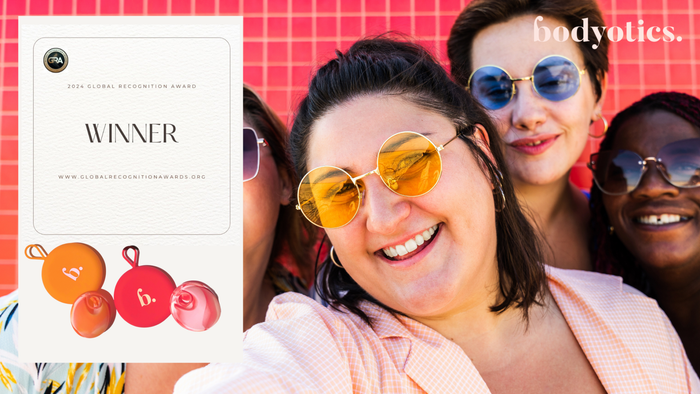 Smiling diverse women wearing sunglasses celebrating Bodyotics' 2024 Global Recognition Award for innovative women's health menstrual care solutions.