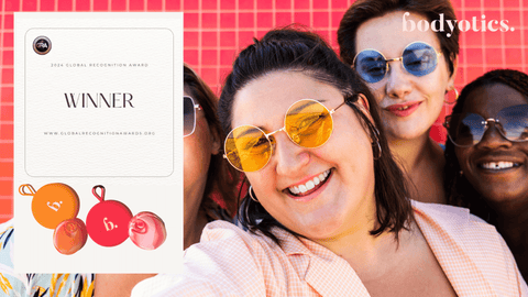 Smiling diverse women wearing sunglasses celebrating Bodyotics' 2024 Global Recognition Award for innovative women's health menstrual care solutions.