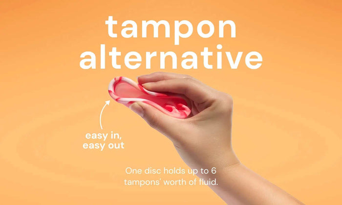 Hand holding a reusable menstrual disc with text highlighting it as a tampon alternative that is easy to insert and remove, holding up to six tampons' worth of fluid.
