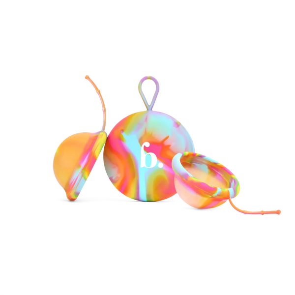 Bodyotics Comfydisc Rainbow Edition reusable menstrual discs with pull-off string and carrying pouch, colorful silicone design.