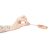 Hand holding a Bodyotics Comfydisc Rainbow Edition reusable menstrual disc with pull-off string, showcasing rainbow colors and body-safe silicone design.