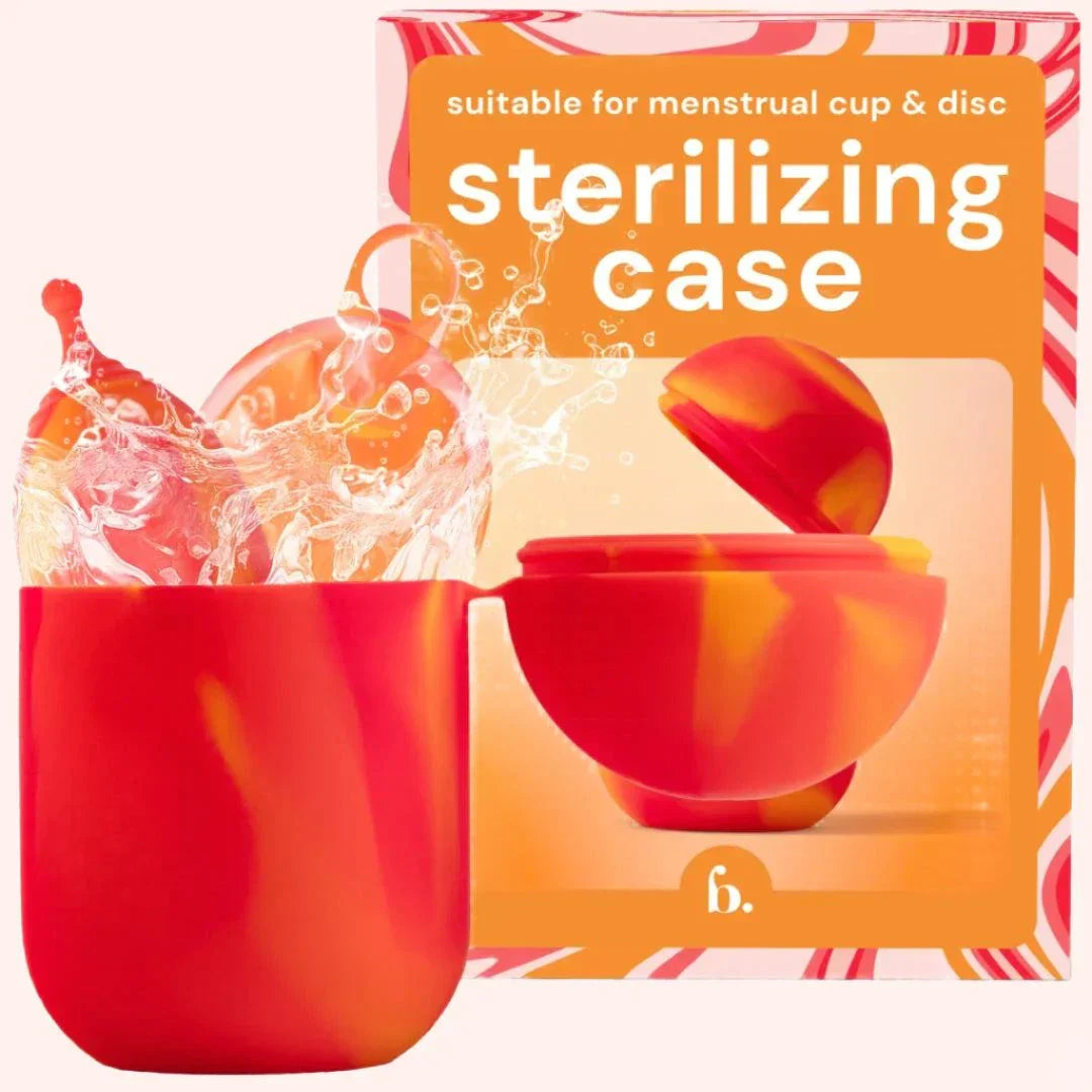 Compact red and orange Bodyotics Comfycase menstrual cup sterilizer with splash effect and packaging box in background